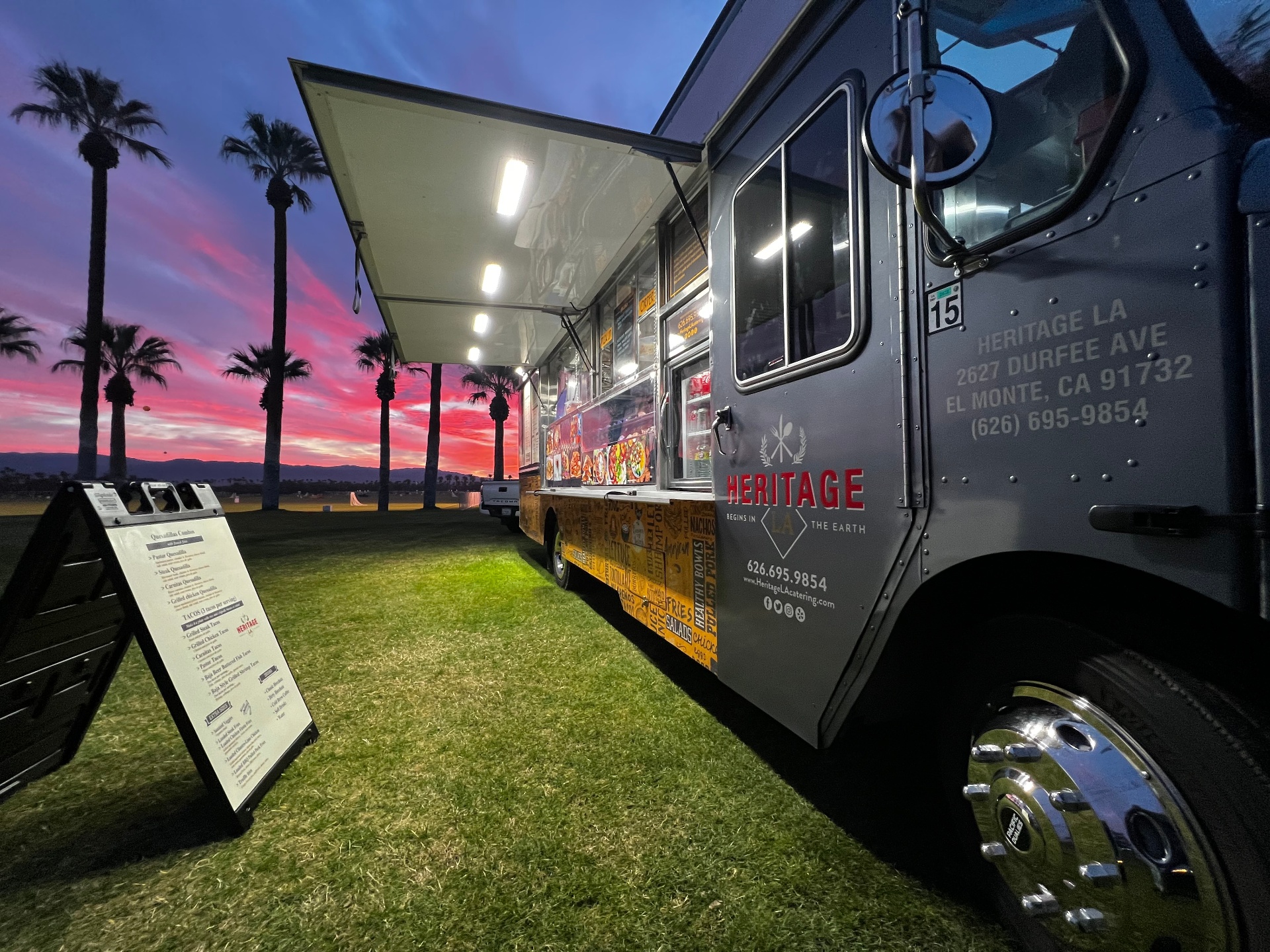 Food truck at sunset with silhouetted palm trees in Southern California